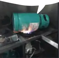 a green propane tank is sitting on a stove