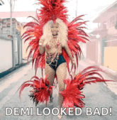 a woman in a carnival costume is walking down a street with the caption demi looked bad
