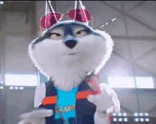 a husky mascot is wearing sunglasses and a shirt that says love