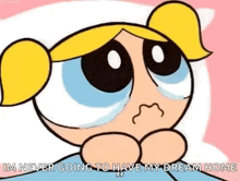 bubbles from the powerpuff girls is crying while laying in bed .