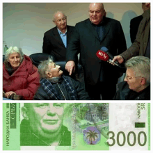 a group of people are gathered around a 3000 sr banknote