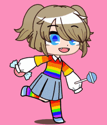 a girl in a rainbow outfit is holding a lollipop and a candy