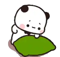 a panda bear is laying on a green pillow .
