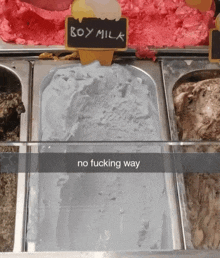 a display of ice cream with a sign that says boy milk on it