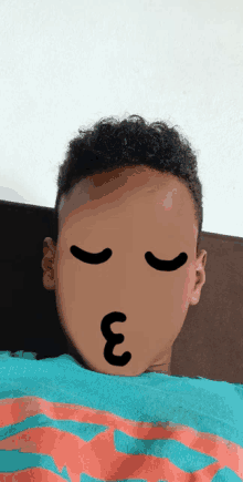 a child with a cartoon face drawn on his face with the letter e on it