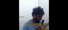 a man with a beard is singing into a microphone and says hi george bro - jazz .