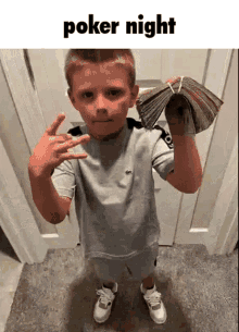 a young boy is holding a stack of money in front of a door with the words poker night above him