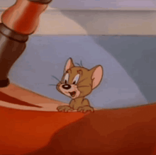 a close up of jerry from tom and jerry looking at the camera
