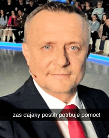 a man in a suit and tie has a caption that says " zas dajaky postih potrebuje pomoc "