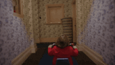 a girl in a red sweater is sitting in a hallway