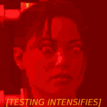 a red background with a woman 's face and the words " testing intensifies " below her