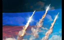 three rockets are flying through the air in front of a flag