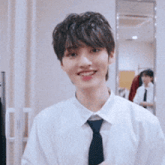 a young man making a heart shape with his hands and says i love you