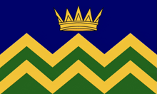 a blue background with yellow and green chevrons and a crown