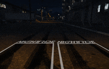 the word nightride is painted on a road