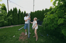 a man and a girl are working on a pole
