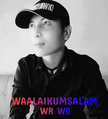 a black and white photo of a man wearing a baseball cap with the words waalaikumsalam wr wb