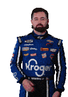 a man with a beard wears a blue kroger racing suit