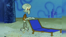 squidward from spongebob squarepants is standing next to a blue chair on the beach .