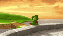 a pixel art of a frog sitting on a wall with a sunset in the background