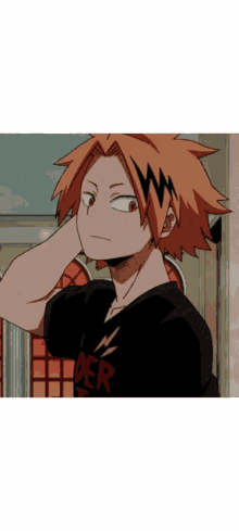 a boy with orange hair is wearing a black shirt with der on it