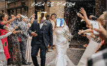 a bride and groom are being showered with confetti in front of a sign that says casa de piastra