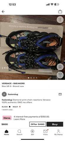 a phone screen shows a pair of versace sneakers on sale