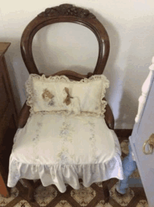 a chair with a pillow on it sits in a room