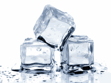 three ice cubes stacked on top of each other on a table