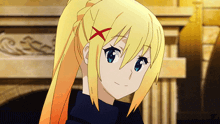a girl with blonde hair has a red x on her head