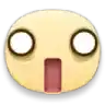 a close up of a yellow emoji with a surprised look on its face and a red mouth .