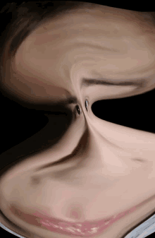 a blurry picture of a woman 's face with a swirl in the middle