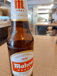 a bottle of mahou sits on a table