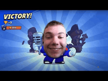 a man is holding a microphone in front of a screen that says victory !