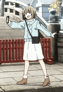 a girl in a blue sweater and white skirt is taking a picture of herself