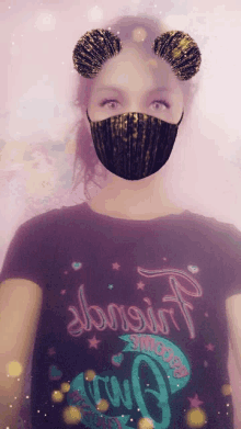 a girl wearing a mask and a t-shirt that says almost