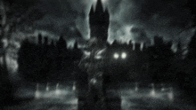 a statue with glowing eyes is standing in front of a castle at night .