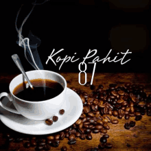 a cup of coffee sits on a saucer surrounded by coffee beans and the word kopi