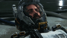 a man wearing a futuristic helmet with the letter f on the front