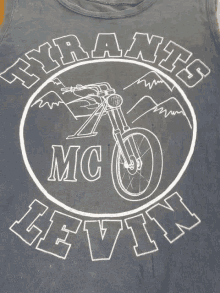 a black tank top with a picture of a motorcycle and the words tyrants mc cevin