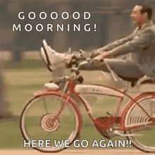 a man is riding a bicycle with his feet up and the words `` here we go again '' .