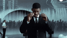 a man in a suit and tie is adjusting his tie