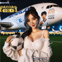 a woman holding a soccer ball in front of an airplane that says museum bola on it