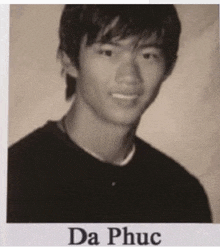 a black and white photo of a man with the name da phục