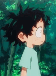 deku from my hero academia is standing in the woods looking at the camera .