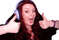 a woman with red hair is wearing headphones and giving a thumbs up