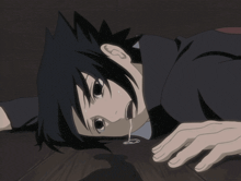 a cartoon character is laying on the floor with a tear running down his face