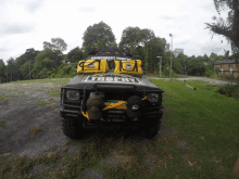 a trophy jeep is parked in the grass