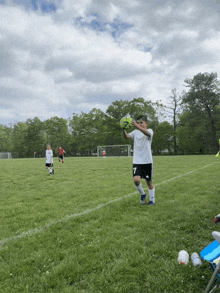 a boy in a white jersey with the number 7 on it