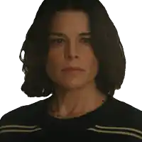 a woman wearing a black and white striped shirt has a necklace around her neck